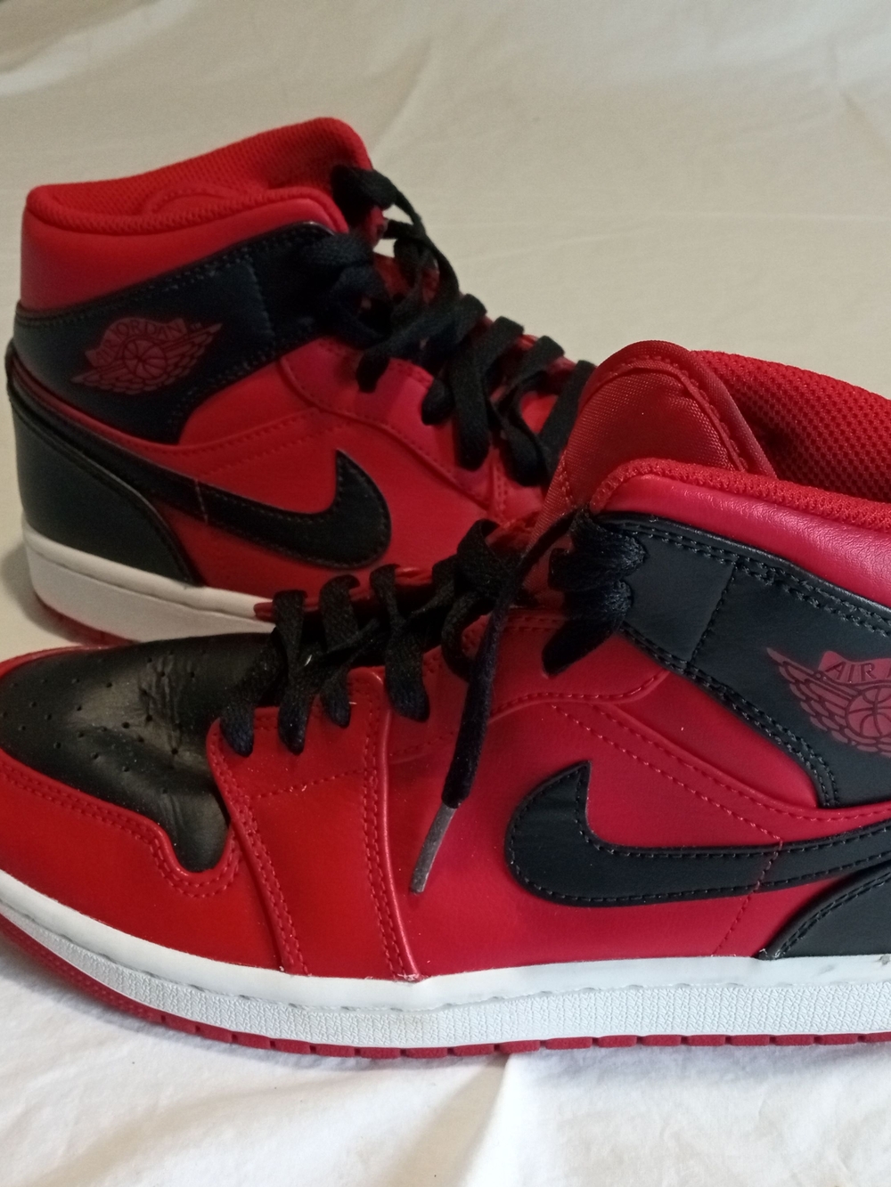 Jordan Red and Black High-Top Sneaker Interior Tag Detail